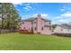 Spacious backyard with a green lawn, a wooden deck, and a privacy fence for outdoor enjoyment at 7847 Wrotham Cir, Atlanta, GA 30349