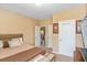 Comfortable bedroom featuring a bed, storage bench and closet space at 7847 Wrotham Cir, Atlanta, GA 30349
