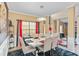 Open dining room with bright lighting, set table, and stylish decor at 7847 Wrotham Cir, Atlanta, GA 30349