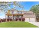 Charming two-story brick home with a manicured front lawn and attached two-car garage at 7847 Wrotham Cir, Atlanta, GA 30349