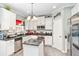 Bright kitchen features granite countertops, stainless steel appliances, and a convenient center island at 7847 Wrotham Cir, Atlanta, GA 30349