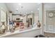 Bright kitchen with stainless appliances and island, open to living area at 7847 Wrotham Cir, Atlanta, GA 30349