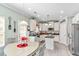 Bright kitchen with stainless appliances, granite countertops, and eat-in breakfast area at 7847 Wrotham Cir, Atlanta, GA 30349