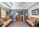 Living room featuring a ceiling fan, hardwood floors, and bright walls at 7847 Wrotham Cir, Atlanta, GA 30349