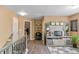 Loft area with hardwood floors, display cabinet, and views to the stairs at 7847 Wrotham Cir, Atlanta, GA 30349
