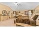 Main bedroom features vaulted ceilings, plush carpet, and ensuite bath at 7847 Wrotham Cir, Atlanta, GA 30349