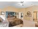 Bedroom featuring vaulted ceilings, plush carpet, and views to the ensuite bath at 7847 Wrotham Cir, Atlanta, GA 30349