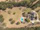 A sprawling estate featuring a luxurious pool area and scenic, wooded surroundings for ultimate privacy at 8906 E Carroll Rd, Winston, GA 30187