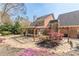 Beautiful backyard patio with pergola, stone accents, and lush landscaping, perfect for outdoor entertaining at 8906 E Carroll Rd, Winston, GA 30187