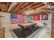 Unfinished basement with exposed ceiling, painted walls, and a large game area featuring a pool table at 8906 E Carroll Rd, Winston, GA 30187