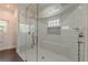 Contemporary bathroom with white tiles, modern fixtures, and a glass shower enclosure at 8906 E Carroll Rd, Winston, GA 30187