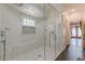 Luxurious bathroom with a large glass-enclosed shower and stylish white tile at 8906 E Carroll Rd, Winston, GA 30187