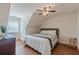 Comfortable bedroom featuring a decorative ceiling fan and a large window at 8906 E Carroll Rd, Winston, GA 30187