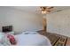 Cozy bedroom with a ceiling fan, double closet, and view to another room at 8906 E Carroll Rd, Winston, GA 30187