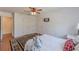 Bedroom with ceiling fan, double closet, rug, and view to the exterior at 8906 E Carroll Rd, Winston, GA 30187