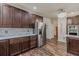 Beautiful kitchen featuring dark wood cabinets, subway tile backsplash, and stainless appliances at 8906 E Carroll Rd, Winston, GA 30187