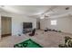 Spacious living room with neutral carpet, a ceiling fan, and plenty of natural light at 8906 E Carroll Rd, Winston, GA 30187