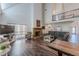 Spacious living room with soaring ceilings, a fireplace, and dark wood floors at 8906 E Carroll Rd, Winston, GA 30187