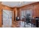 Charming office featuring wood-paneled walls, a ceiling fan, and wood-look floors at 8906 E Carroll Rd, Winston, GA 30187