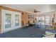 Cozy sunroom with ample seating, brick accent wall, and natural light, creating a relaxing atmosphere at 8906 E Carroll Rd, Winston, GA 30187