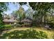 Expansive backyard features a large grassy area, beautiful landscaping, and a charming fence at 1209 The By Ne Way, Atlanta, GA 30306