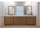 Bathroom with dual sinks, ample counter space, and decorative mirrors at 1209 The By Ne Way, Atlanta, GA 30306