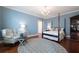 This bedroom features a four-poster bed, hardwood floors, vintage cabinet, a chandelier, and an accent chair at 1209 The By Ne Way, Atlanta, GA 30306