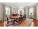 Elegant dining room with hardwood floors, large windows, and a decorative chandelier at 1209 The By Ne Way, Atlanta, GA 30306