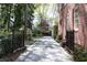 Long driveway with landscaping and brick accents leads to the home at 1209 The By Ne Way, Atlanta, GA 30306