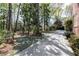 Long driveway with landscaping and brick accents leads to the home at 1209 The By Ne Way, Atlanta, GA 30306