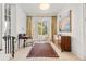 Inviting entryway featuring white brick walls, tile floors, and a vintage desk and dresser at 1209 The By Ne Way, Atlanta, GA 30306