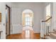 Grand foyer with hardwood floors, staircase, arched doorway, and access to an elevator at 1209 The By Ne Way, Atlanta, GA 30306