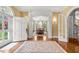 Elegant foyer featuring hardwood floors, an area rug, and a formal dining room in view at 1209 The By Ne Way, Atlanta, GA 30306
