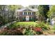 Well-maintained brick home with a manicured lawn and colorful flowerbeds at 1209 The By Ne Way, Atlanta, GA 30306