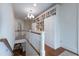 Hallway with beautiful built-in bookshelves and a chandelier, offering lots of storage at 1209 The By Ne Way, Atlanta, GA 30306