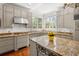 Well-lit kitchen with granite counters, stainless steel appliances, and a functional center island at 1209 The By Ne Way, Atlanta, GA 30306
