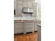 Kitchen boasts stainless steel appliances and sleek cabinetry and gas cooktop at 1209 The By Ne Way, Atlanta, GA 30306