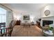 Inviting living room features a fireplace, built-ins, and abundant natural light at 1209 The By Ne Way, Atlanta, GA 30306