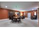 Large living area with a piano, seating for eight, and glass paneled patio doors to let in natural light at 1209 The By Ne Way, Atlanta, GA 30306