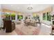 Sunroom with lots of natural light with a vaulted ceiling and chandelier at 1209 The By Ne Way, Atlanta, GA 30306