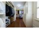Large walk-in closet with custom shelving, shoe storage, and great organization at 1209 The By Ne Way, Atlanta, GA 30306