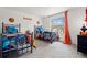 ' bedroom with carpeted floors, two beds, a window, and a basketball theme at 2560 Ashley Downs Ln, South Fulton, GA 30349