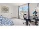 Bedroom featuring carpeted floors, a desk, and a large window offering natural light at 2560 Ashley Downs Ln, South Fulton, GA 30349