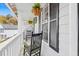 Charming front porch with rocking chairs and decorative hanging plants at 2560 Ashley Downs Ln, South Fulton, GA 30349