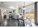 Eat-in kitchen with gray cabinetry, stainless steel appliances, and sliding glass doors to backyard at 2560 Ashley Downs Ln, South Fulton, GA 30349