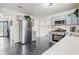 Bright kitchen with gray cabinetry, stainless steel appliances, and breakfast bar at 2560 Ashley Downs Ln, South Fulton, GA 30349