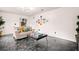 Cozy living room with a comfortable couch, modern decor, and stylish flooring at 2560 Ashley Downs Ln, South Fulton, GA 30349