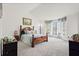 Spacious main bedroom featuring a bay window and decorous furnishings at 2560 Ashley Downs Ln, South Fulton, GA 30349