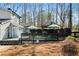 Home backyard featuring a large deck with gazebo and wooded scenery at 1064 Brooks Rackley Rd, Dallas, GA 30157