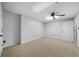 Spacious basement with neutral carpet, drop ceiling, and ceiling fan at 1064 Brooks Rackley Rd, Dallas, GA 30157